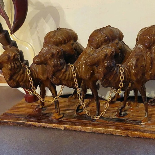 Decorative item used with camels and palm tree made of wood and plastic