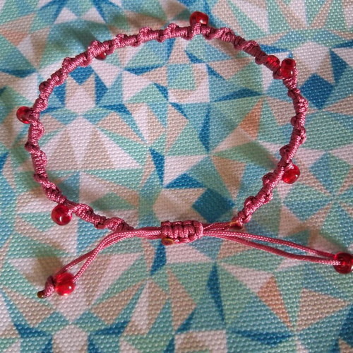 Macrame bracelet with decorative red beads, like new