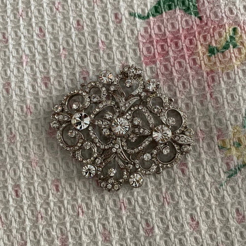 Silver brooch with stones