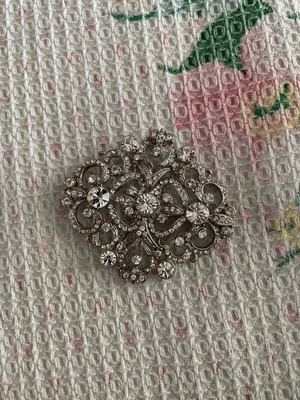 Silver brooch with stones