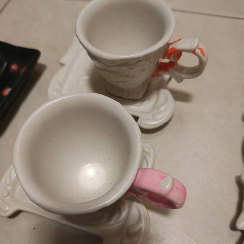 Porcelain glasses used, one slightly broken