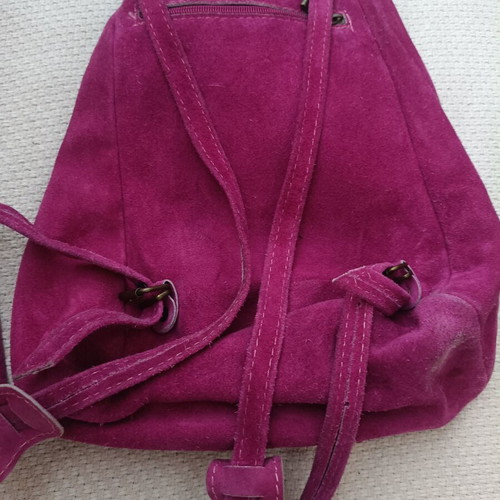 Leather backpack fuchsia used with some wear