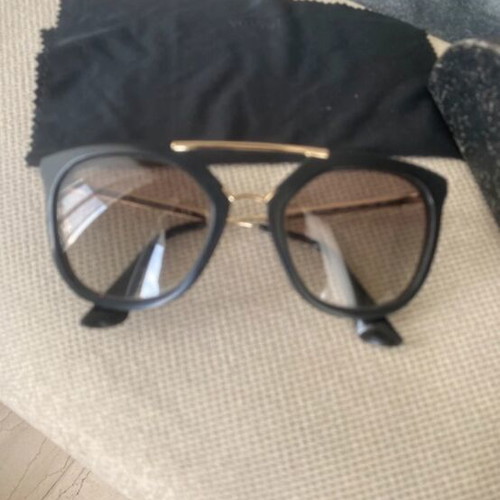 Prada sunglasses in black with gold details