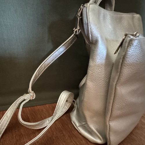 Backpack like new gray silver leatherette with three zippers