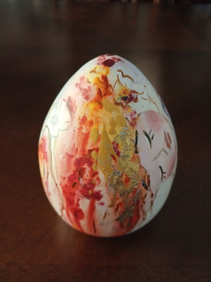 Hand-painted ceramic egg with floral and female figure design