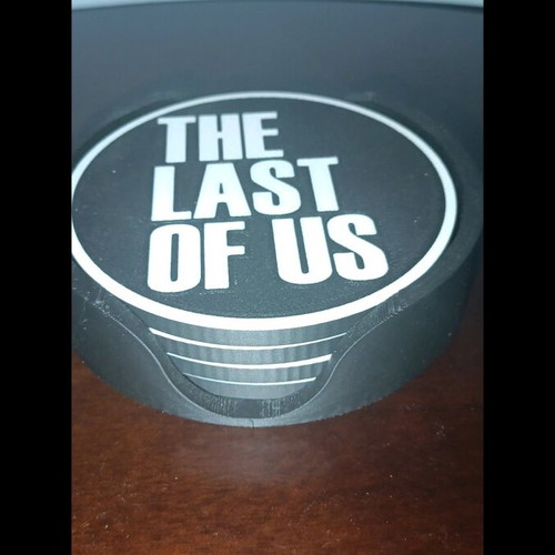 Last of Us coasters like new, set of 4 with base
