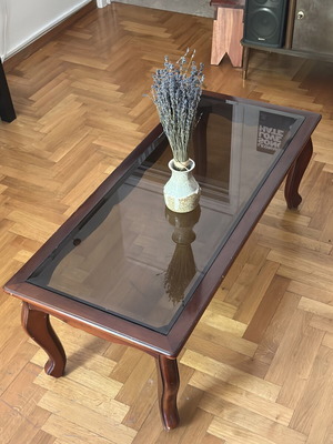 Coffee table used, solid wood frame with smoked glass top