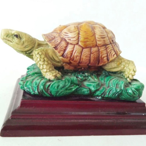 Decorative turtle on wooden base like new