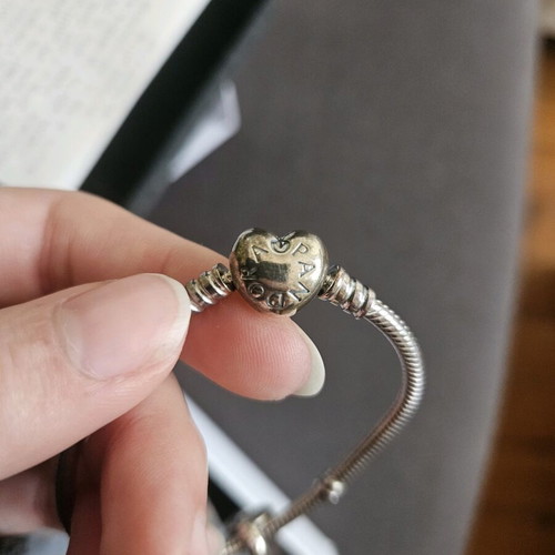 Pandora sterling silver charm bracelet with heart and sister charms like new