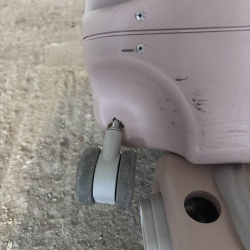 Stokke pink suitcase used with broken wheel part