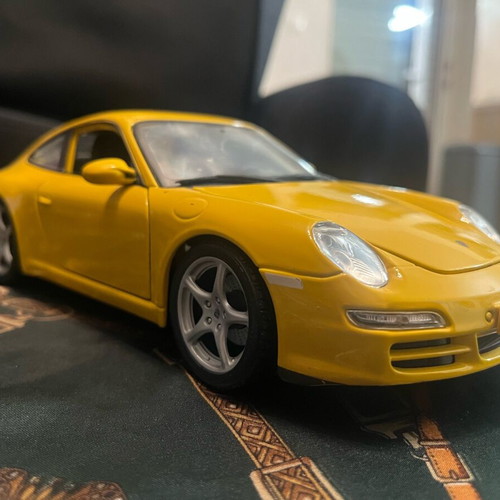 Porsche Carrera yellow 1:18 like new with hazy front windshield
