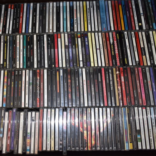 Music collection of 360 rock, pop, metal CDs, 29 music DVDs, 2 VHS tapes, with 2 CD shelves