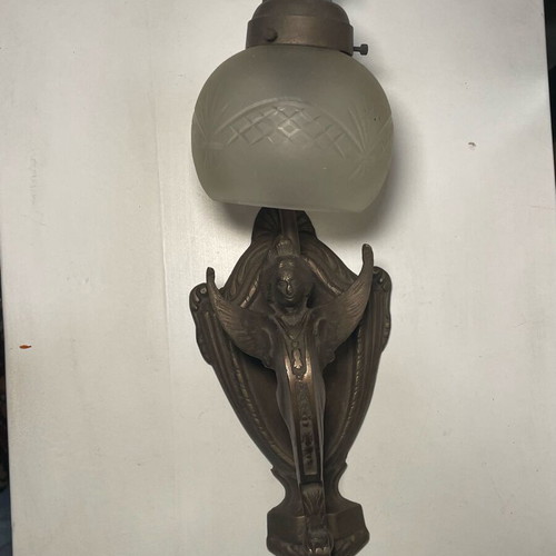 Bronze wall light like new with carved white glass and angel shape