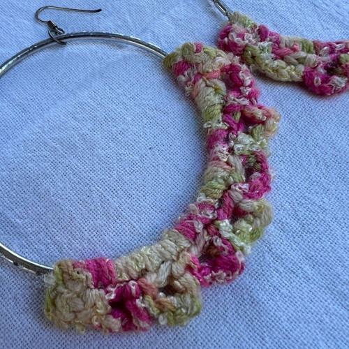 Hoop earrings used with pink and silver knitted detail