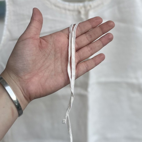Cream linen blouse with cord and decorative edges