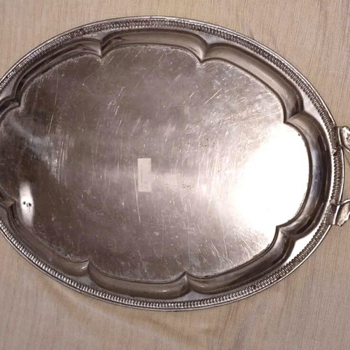 Silver-plated serving tray used with ornate handles