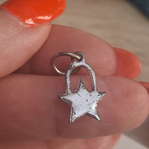 Charm star decorated with sparkling stones used, silver