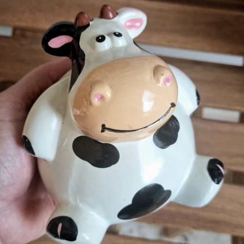 Ceramic cow piggy bank like new, black and white