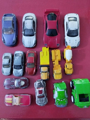Set of used miniature toy cars with signs of wear