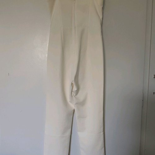 Access jumpsuit extra small white used with minor strap defect