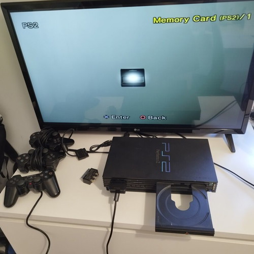 PlayStation 2 Fat console used with 2 controllers, memory card and 21 games