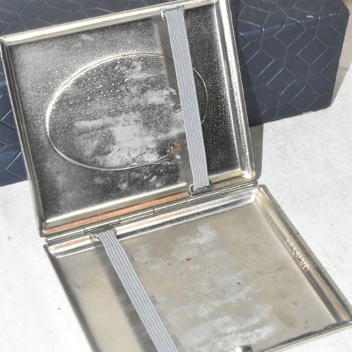 German metal cigarette case used with embossed hunting dog design