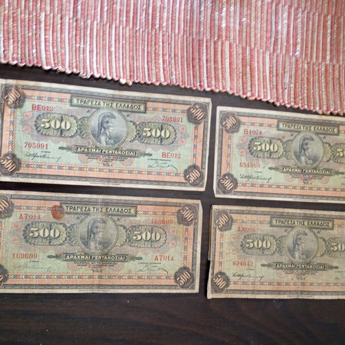 Old collectible banknotes used, 7 of 1000 drachmas and 4 of 500 drachmas