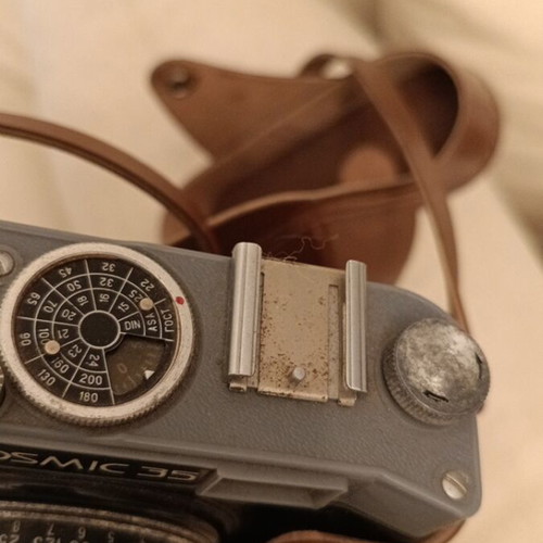 Cosmic 35 camera used, non-functional with leather case