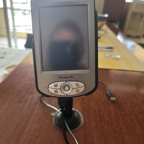 Pocket PC Navigator mio used with mounting base and charging cable