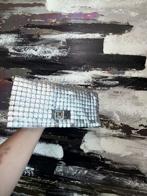 Clutch used silver evening bag with metallic design