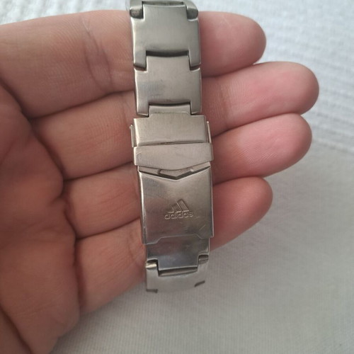 Adidas watch used with black and silver bracelet