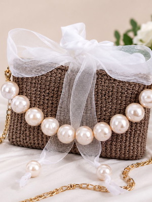 Small woven straw clutch bag