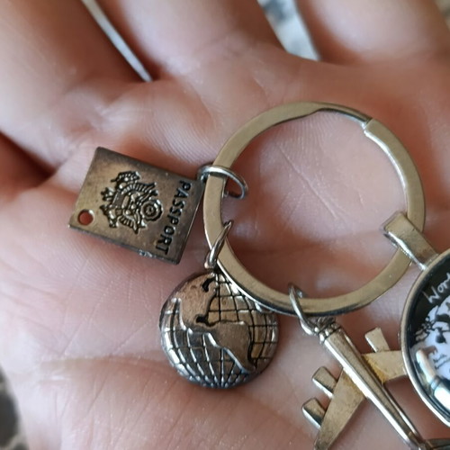 Travel keychain with world map design