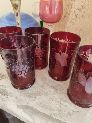 Red glasses with grape clusters and green stem glasses