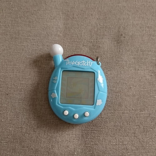 Tamagotchi Connection V4 blue used with cloud pattern