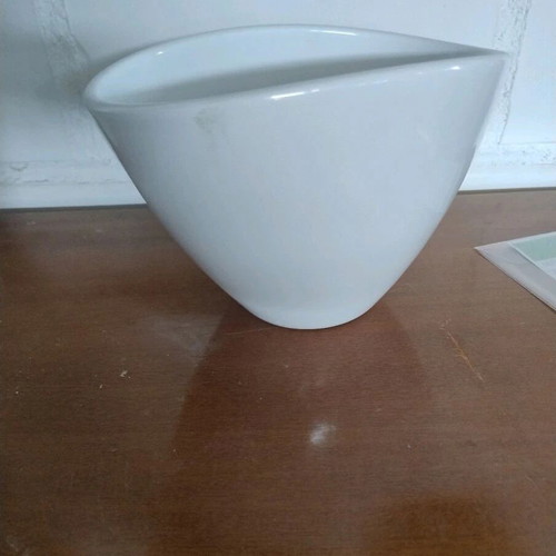 White flowerpot with unique opening
