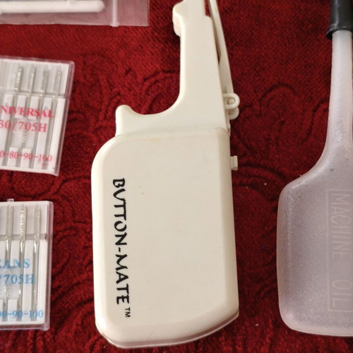 Sewing Machine Accessories Set like new with Needles, Button-Mate Tool & Oil