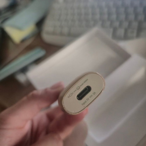 Iqos ILUMA One Gold device used with box and cable
