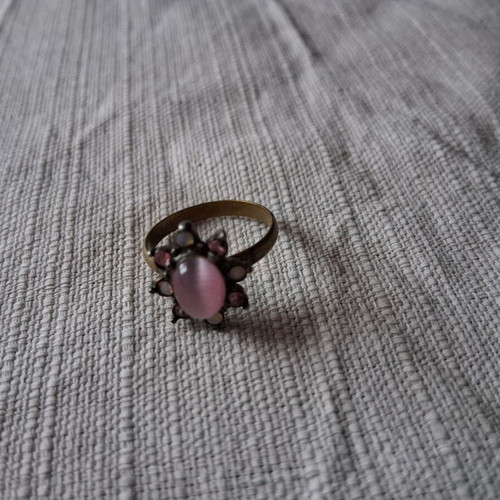 Ring used matte gold color with pink stone and rhinestones