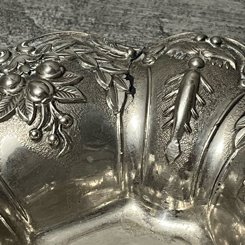 Decorative metal bowl used with embossed design