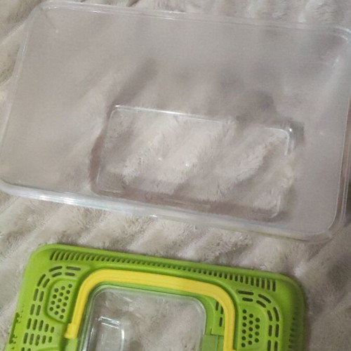Plastic aquarium used with orange and blue gravel and accessories
