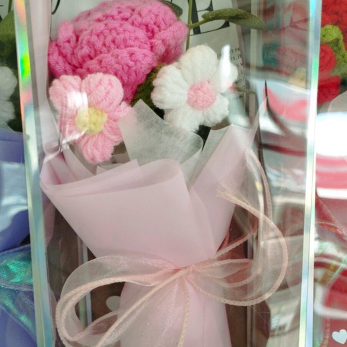Artificial flower bouquet like new with knitted flower and plastic leaves