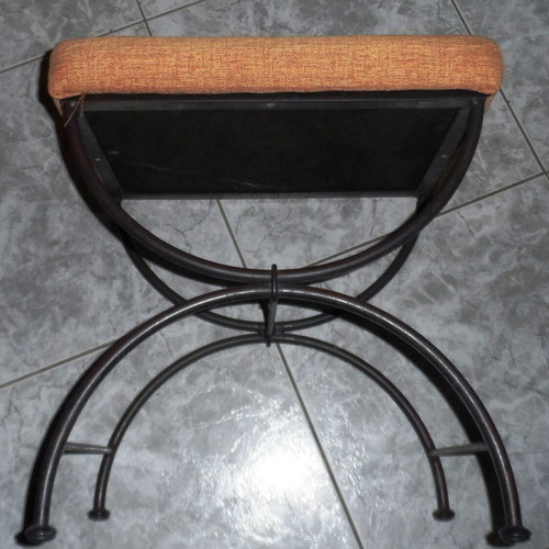 Vintage stool with iron base used, ancient Roman style