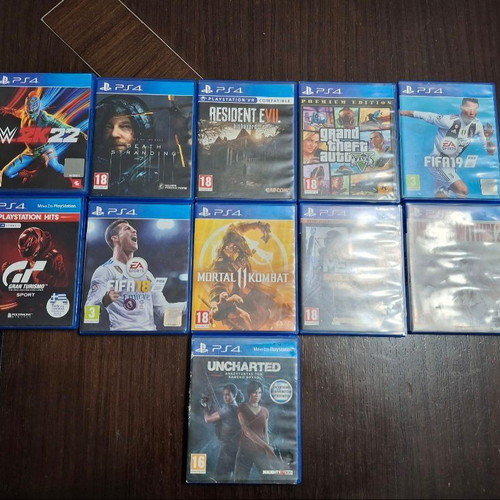 PlayStation 4 console used with 2 controllers, 11 games and cooling stand