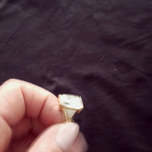 Ring made of gold steel with transparent white stone like new