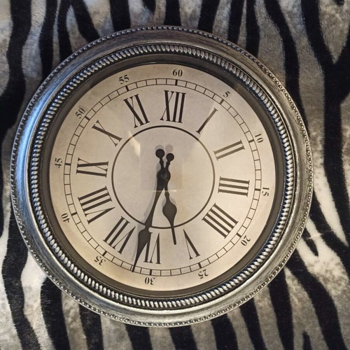 Wall clock new, silver painted, plastic material