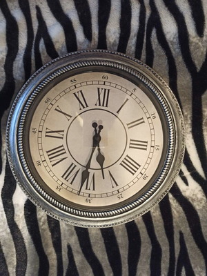 Wall clock new, silver painted, plastic material