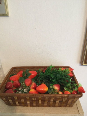 Basket with artificial fruits like new