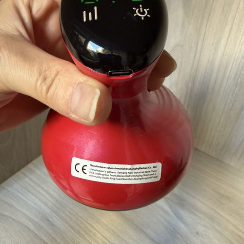 Electric body massage device with cupping and heating