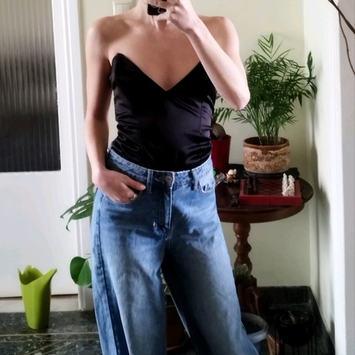 Black corset used with pointed neckline and leather look, size XS